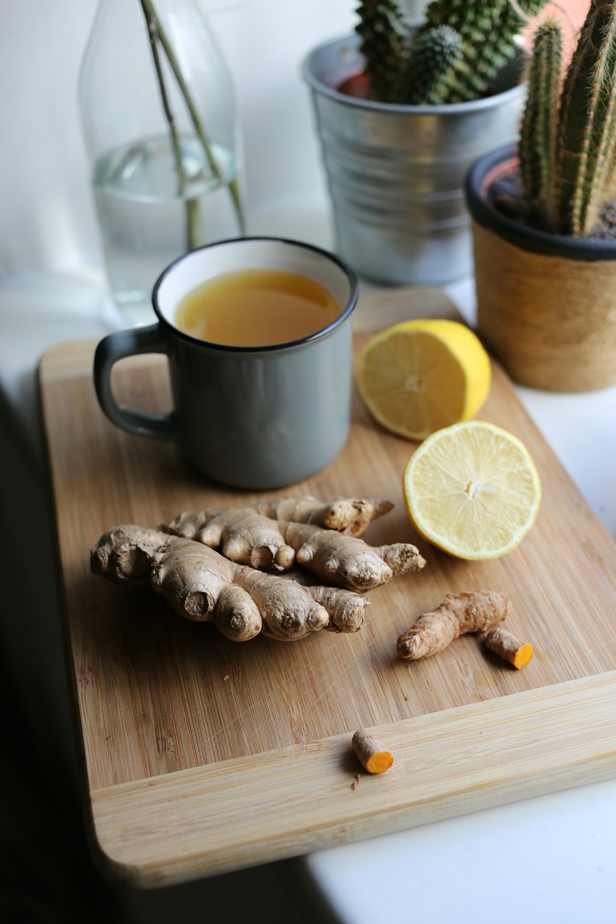 Ginger tea with fresh ginger root and lemon