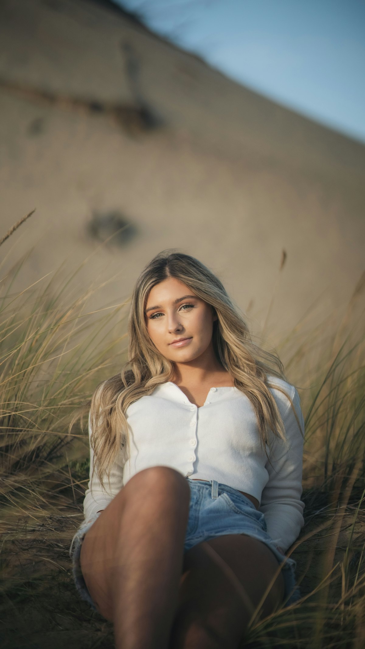 Portrait in tall grass at sunset