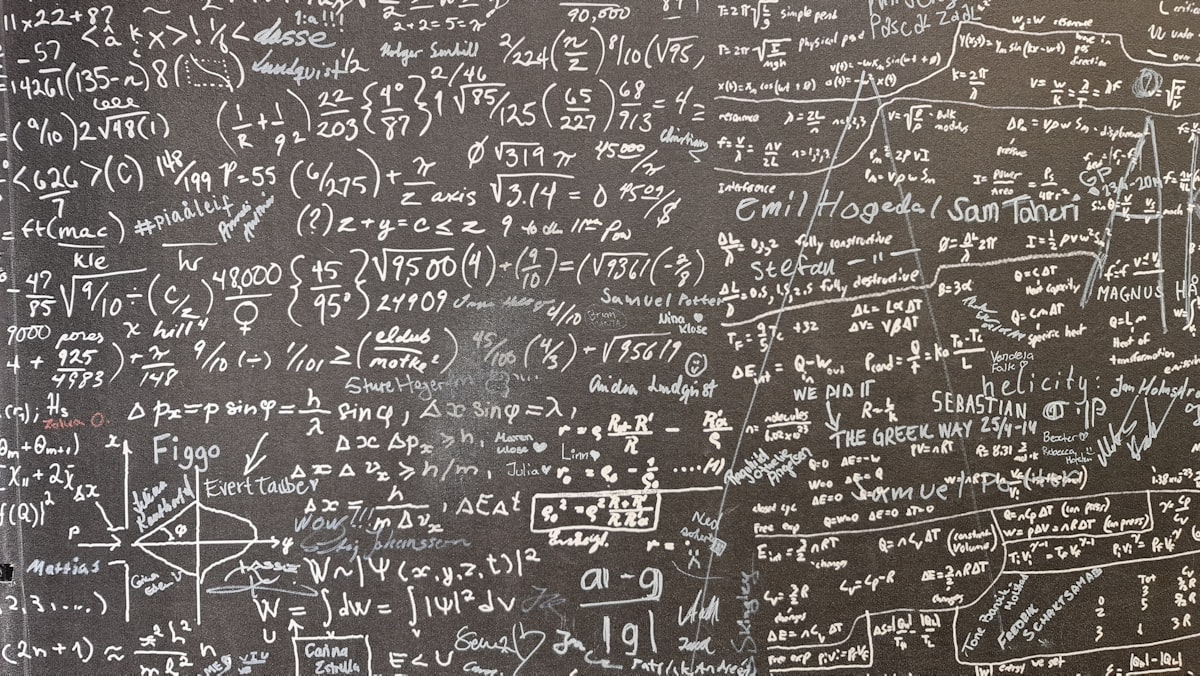 Whiteboard covered in equations